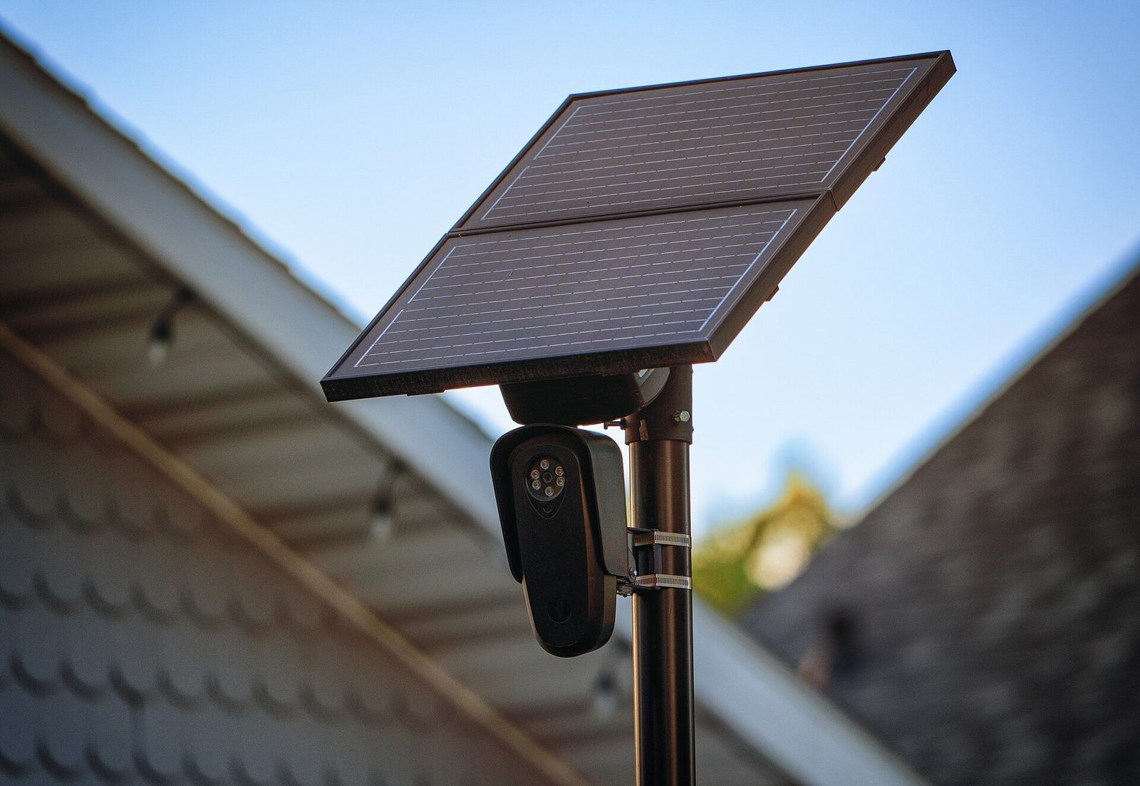 Close-up of a fixed license plate reader camera under a solar panel